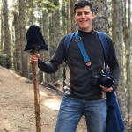 Boy Standing with Stick