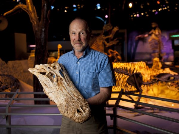 David holding alligator fossil skull