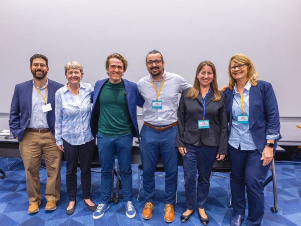 Panelists smiling for pictures